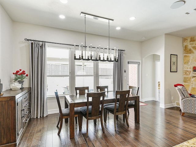 505 Peterhouse Dr, Mckinney, TX 75071 - dining room featuring arched walkways, dark wood finished floors, and recessed lighting