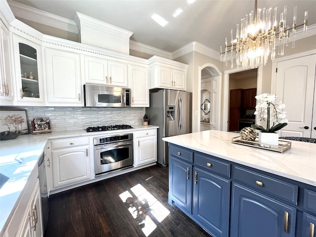 4716 Eva Pl, Plano, TX 75093 - kitchen featuring stainless steel appliances, blue cabinets, white cabinets, dark wood-style floors, and arched walkways