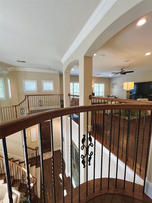 4716 Eva Pl, Plano, TX 75093 - staircase featuring crown molding, a ceiling fan, wood finished floors, recessed lighting, and arched walkways