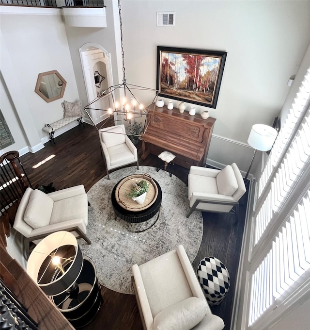 4716 Eva Pl, Plano, TX 75093 - living area with wood finished floors and arched walkways