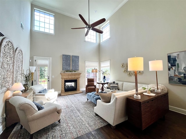 4716 Eva Pl, Plano, TX 75093 - living area featuring ornamental molding, wood finished floors, a towering ceiling, ceiling fan, and healthy amount of natural light