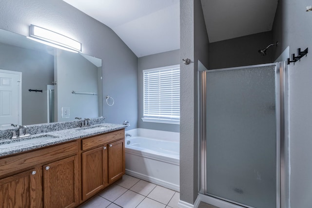 3106 Connor Ln, Wylie, TX 75098 - bathroom featuring a shower stall, a bath, double vanity, tile patterned floors, and vaulted ceiling