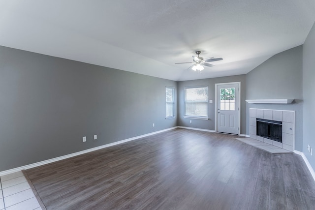 3106 Connor Ln, Wylie, TX 75098 - unfurnished living room featuring a ceiling fan, a fireplace, and wood finished floors