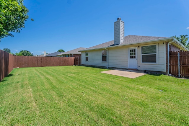 3106 Connor Ln, Wylie, TX 75098 - back of house featuring a fenced backyard, a patio, a chimney, and a shingled roof