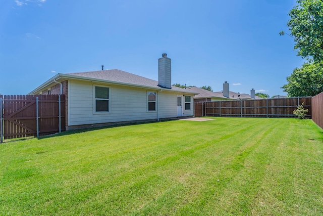 3106 Connor Ln, Wylie, TX 75098 - rear view of house with a fenced backyard and a chimney