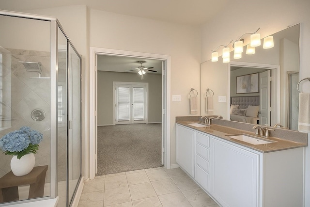 9207 Lake Pointe Dr, Temple, TX 76502 - bathroom featuring a ceiling fan, a stall shower, double vanity, and connected bathroom