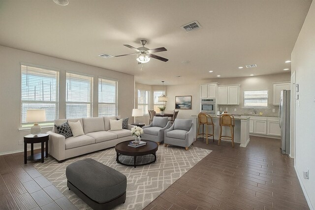 9207 Lake Pointe Dr, Temple, TX 76502 - living area featuring wood finish floors, ceiling fan, and recessed lighting