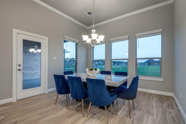 1301 Wilderness Ln, Forney, TX 75126 - dining space featuring a chandelier, ornamental molding, and light wood-type flooring