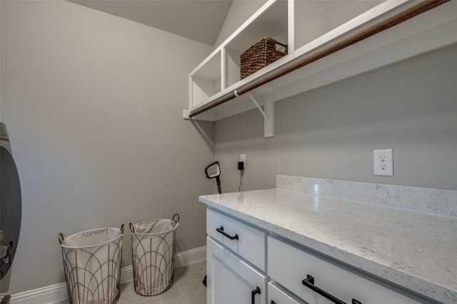 1301 Wilderness Ln, Forney, TX 75126 - washroom with cabinet space and light tile patterned flooring