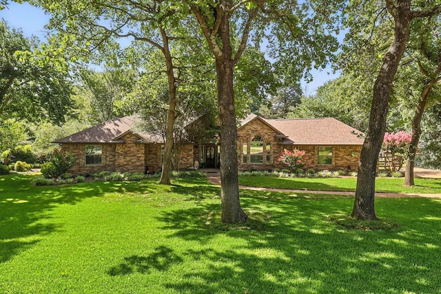 1812 Winding Creek Blvd, Flower Mound, TX 75022 - ranch-style home with a front lawn and brick siding