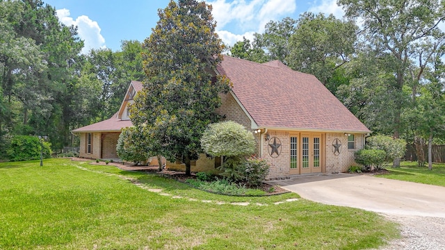 106 Fcr 1271, Fairfield, TX 75840 - view of front of property featuring brick siding, a front lawn, french doors, and driveway