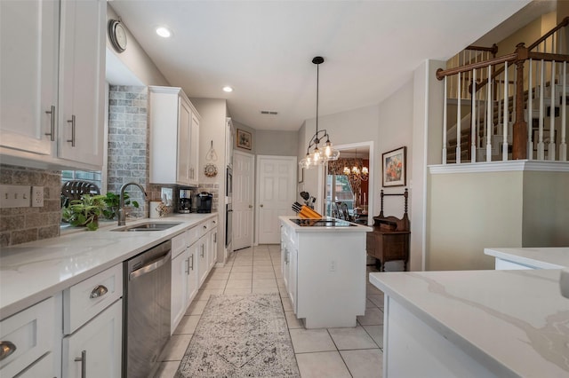 901 Brown Trl, Coppell, TX 75019 - kitchen with stainless steel dishwasher, backsplash, white cabinets, light tile patterned floors, and pendant lighting
