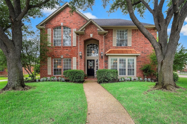 901 Brown Trl, Coppell, TX 75019 - traditional home with brick siding and a front yard