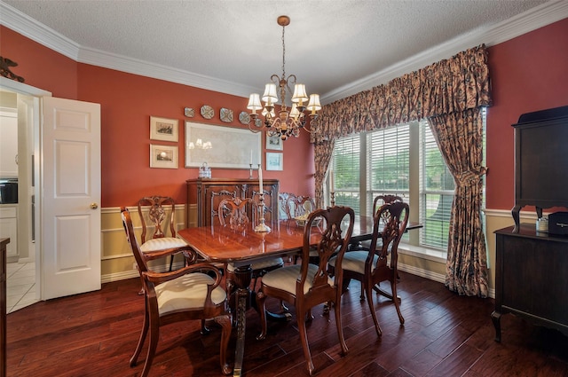 901 Brown Trl, Coppell, TX 75019 - dining area with crown molding, a textured ceiling, hardwood / wood-style floors, and a chandelier
