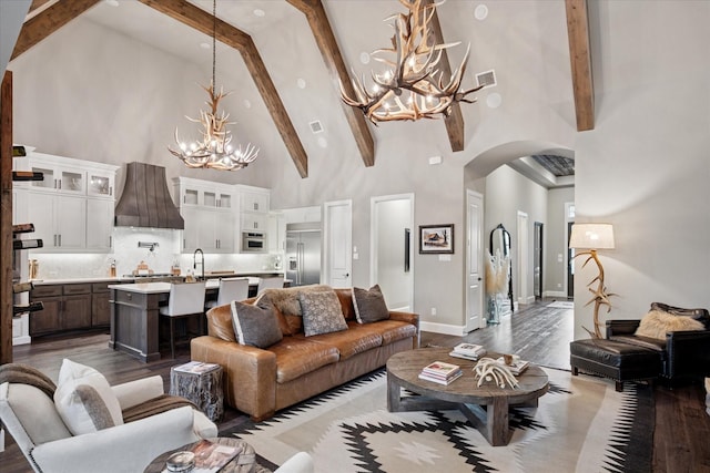 15111 Spider Lily Rd, Frisco, TX 75035 - living room with a chandelier, high vaulted ceiling, arched walkways, dark wood-style floors, and beamed ceiling
