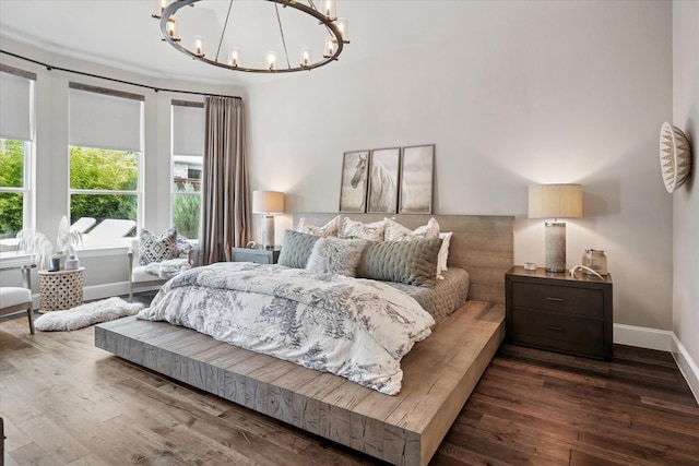 15111 Spider Lily Rd, Frisco, TX 75035 - bedroom featuring a chandelier and wood finished floors