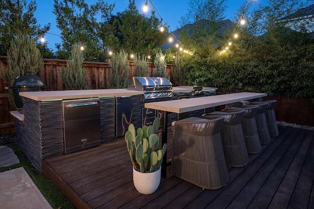15111 Spider Lily Rd, Frisco, TX 75035 - wooden deck with exterior kitchen and outdoor dining space