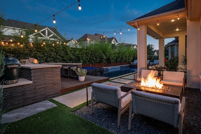15111 Spider Lily Rd, Frisco, TX 75035 - view of patio featuring an outdoor fire pit, a bar, and area for grilling