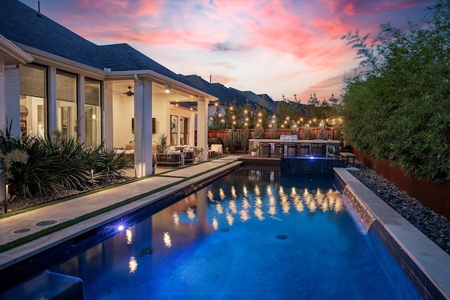 15111 Spider Lily Rd, Frisco, TX 75035 - view of swimming pool featuring area for grilling, a fenced backyard, a ceiling fan, a pool with connected hot tub, and a patio