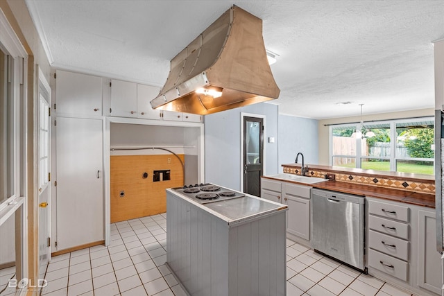 858 River Rd, Shreveport, LA 71105 - kitchen with dishwasher, extractor fan, light tile patterned floors, a textured ceiling, and electric cooktop
