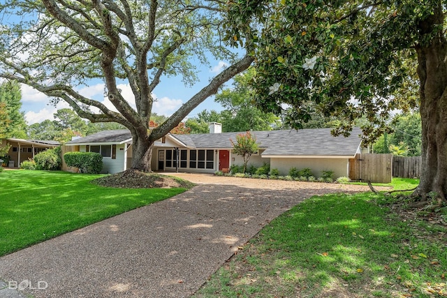 858 River Rd, Shreveport, LA 71105 - view of front of home with a chimney, brick siding, and asphalt driveway
