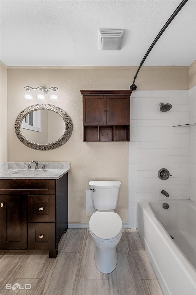 858 River Rd, Shreveport, LA 71105 - full bath featuring vanity, shower / bath combination, wood finished floors, and a textured ceiling