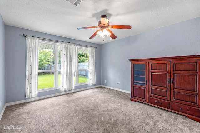 858 River Rd, Shreveport, LA 71105 - unfurnished bedroom with carpet, a textured ceiling, and ceiling fan