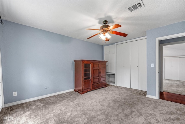 858 River Rd, Shreveport, LA 71105 - unfurnished bedroom featuring carpet floors, a closet, and ceiling fan