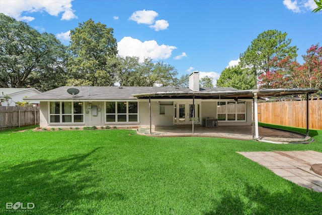 858 River Rd, Shreveport, LA 71105 - back of house featuring a fenced backyard, a patio, a chimney, and brick siding
