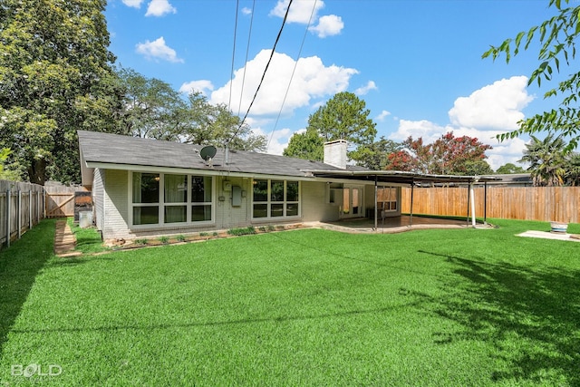 858 River Rd, Shreveport, LA 71105 - rear view of property featuring brick siding, a fenced backyard, a chimney, and a patio