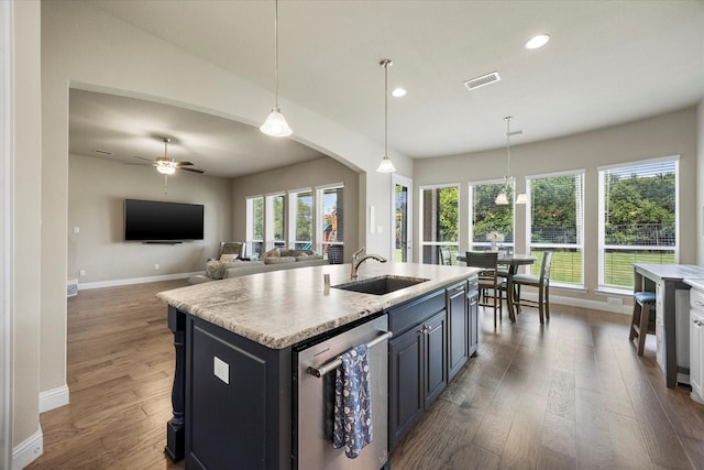 4618 Sky Harbor Dr, Rockwall, TX 75087 - kitchen featuring stainless steel dishwasher, light countertops, wood finished floors, recessed lighting, and pendant lighting