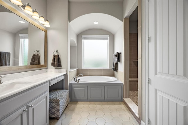 4618 Sky Harbor Dr, Rockwall, TX 75087 - full bathroom featuring healthy amount of natural light, vanity, a bath, tile patterned flooring, and recessed lighting
