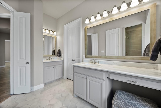 4618 Sky Harbor Dr, Rockwall, TX 75087 - full bathroom featuring vanity, tile patterned flooring, and a tile shower