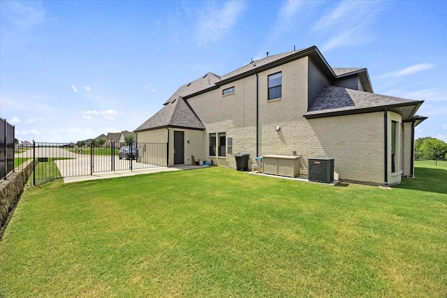 4618 Sky Harbor Dr, Rockwall, TX 75087 - back of house featuring a fenced backyard, roof with shingles, a gate, and brick siding