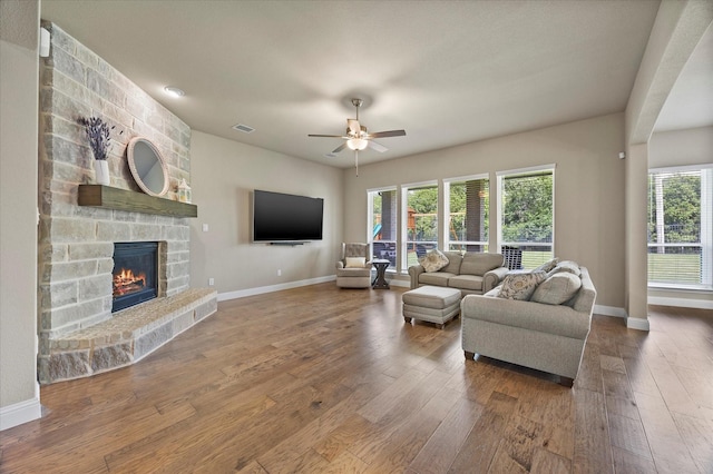 4618 Sky Harbor Dr, Rockwall, TX 75087 - living area featuring a fireplace, hardwood / wood-style flooring, and a ceiling fan