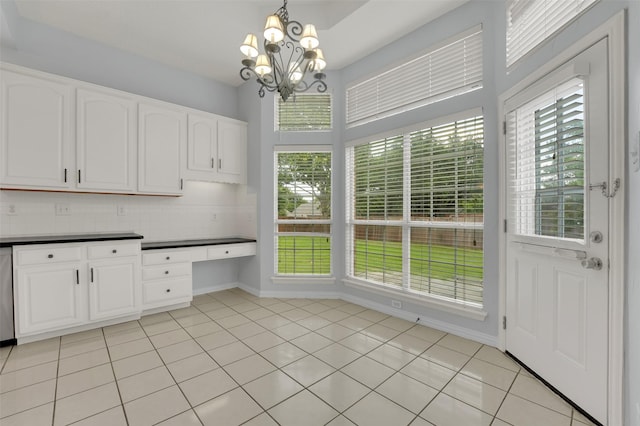 8504 Beatton Ct, Plano, TX 75025 - unfurnished dining area with healthy amount of natural light, a chandelier, and light tile patterned flooring