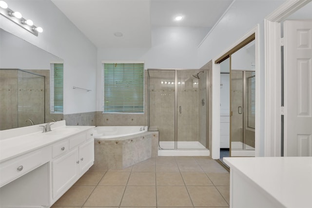 8504 Beatton Ct, Plano, TX 75025 - bathroom with tile patterned floors, vanity, a bath, and a stall shower