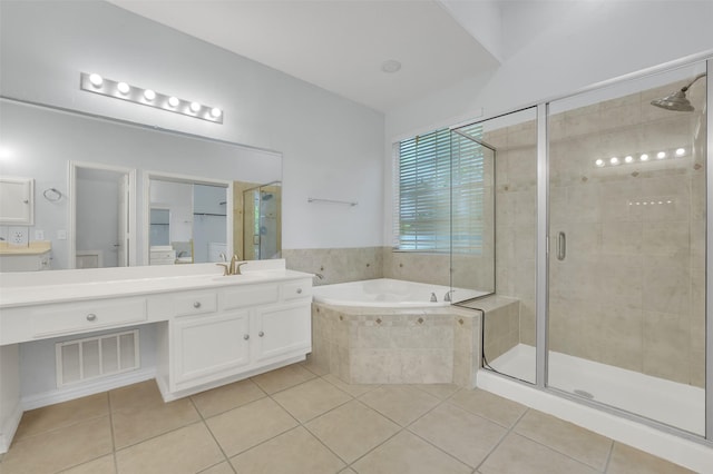 8504 Beatton Ct, Plano, TX 75025 - full bath featuring tile patterned flooring, vanity, a shower stall, and a bath