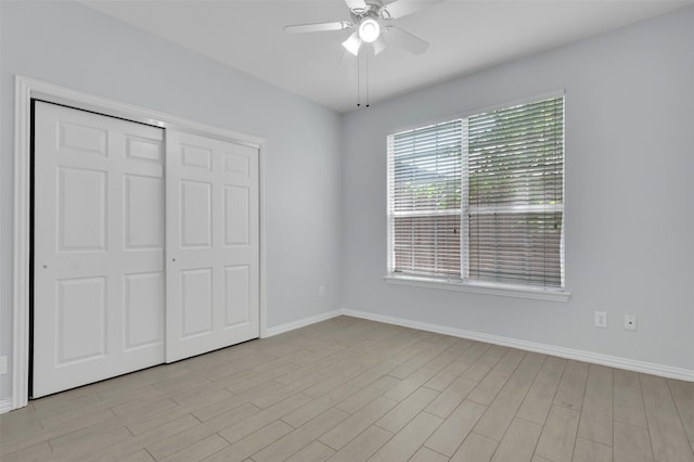 8504 Beatton Ct, Plano, TX 75025 - unfurnished bedroom with a closet, ceiling fan, and light wood finished floors