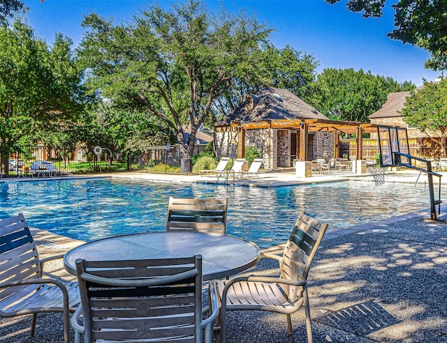 8504 Beatton Ct, Plano, TX 75025 - community pool with a patio area and a pergola