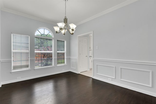 8504 Beatton Ct, Plano, TX 75025 - unfurnished dining area with a chandelier, crown molding, and wood finished floors