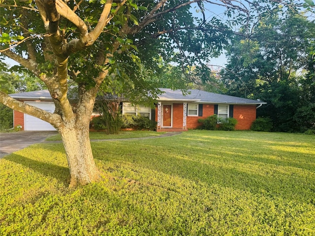 311 E Newland Dr, Robinson, TX 76706 - ranch-style home with a front yard, brick siding, a garage, and concrete driveway