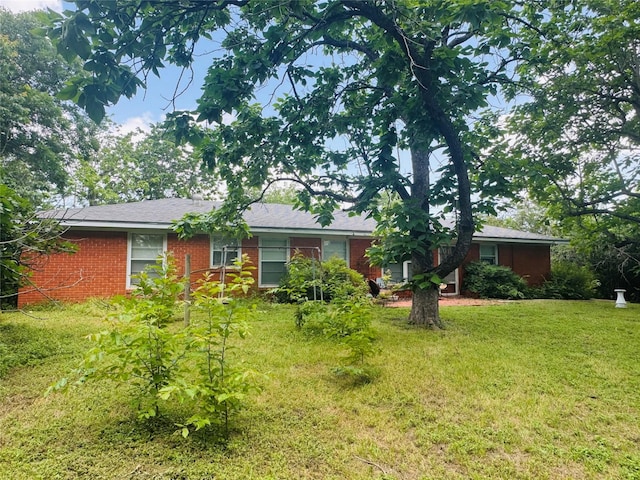 311 E Newland Dr, Robinson, TX 76706 - view of front of house featuring a front lawn and brick siding