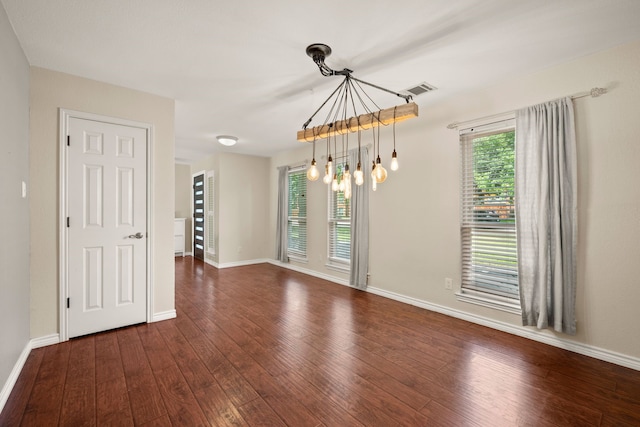 4147 Woodside Knl, Grapevine, TX 76051 - empty room featuring a chandelier and dark wood-style flooring