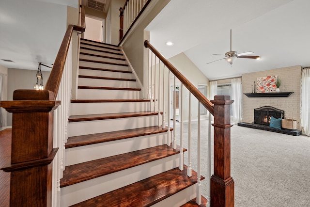 4147 Woodside Knl, Grapevine, TX 76051 - stairs with a ceiling fan, carpet flooring, a brick fireplace, and vaulted ceiling