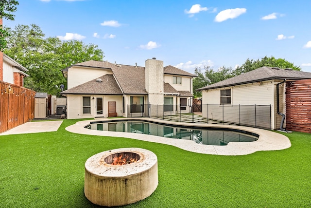 4147 Woodside Knl, Grapevine, TX 76051 - view of pool with a fenced backyard, a fire pit, and a patio area