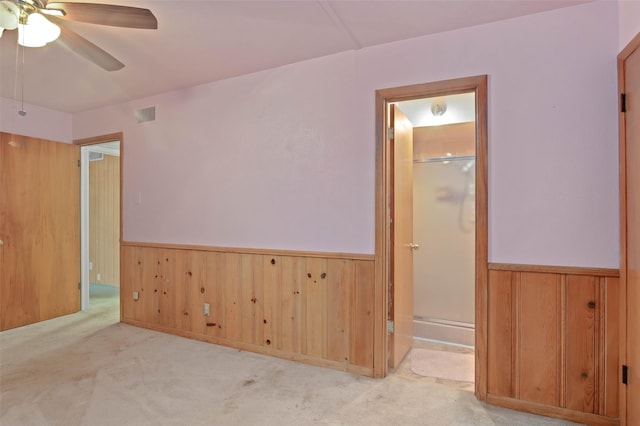 10230 Kilkenny Pl, Dallas, TX 75228 - unfurnished room featuring a wainscoted wall, ceiling fan, carpet flooring, and wood walls