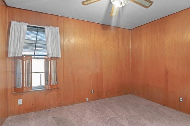 10230 Kilkenny Pl, Dallas, TX 75228 - carpeted empty room with ceiling fan, plenty of natural light, and wooden walls
