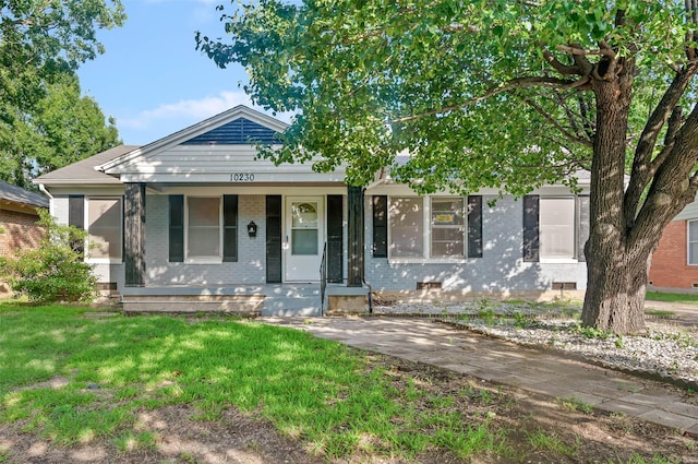 10230 Kilkenny Pl, Dallas, TX 75228 - view of front of home featuring brick siding, covered porch, and a front lawn
