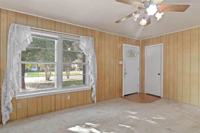 10230 Kilkenny Pl, Dallas, TX 75228 - carpeted spare room featuring wood walls, ceiling fan, and ornamental molding
